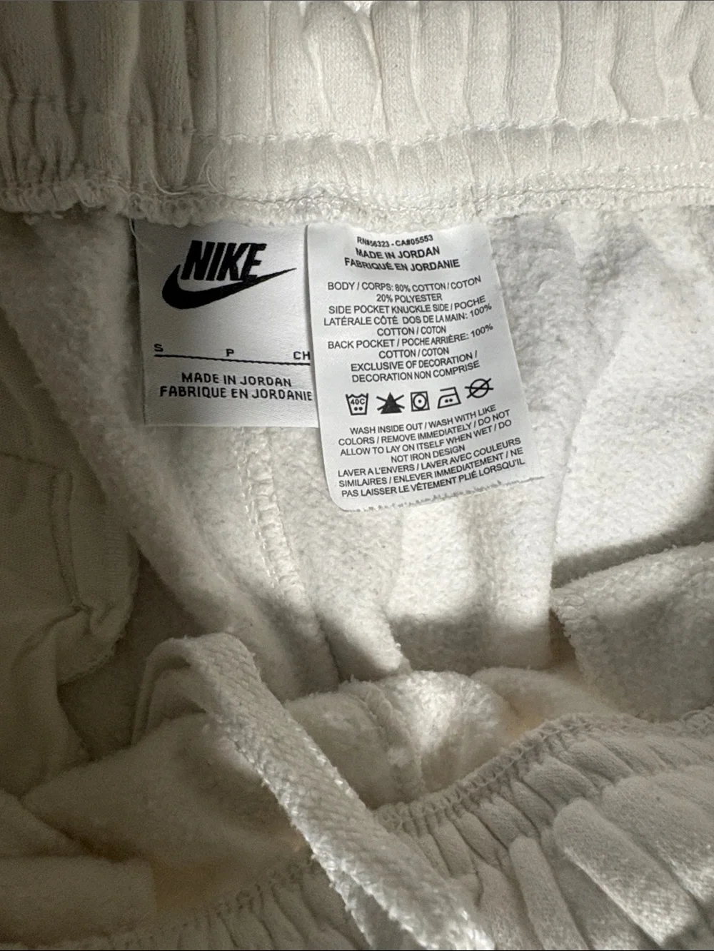 Nike White Athletic Shorts with Black Swoosh
